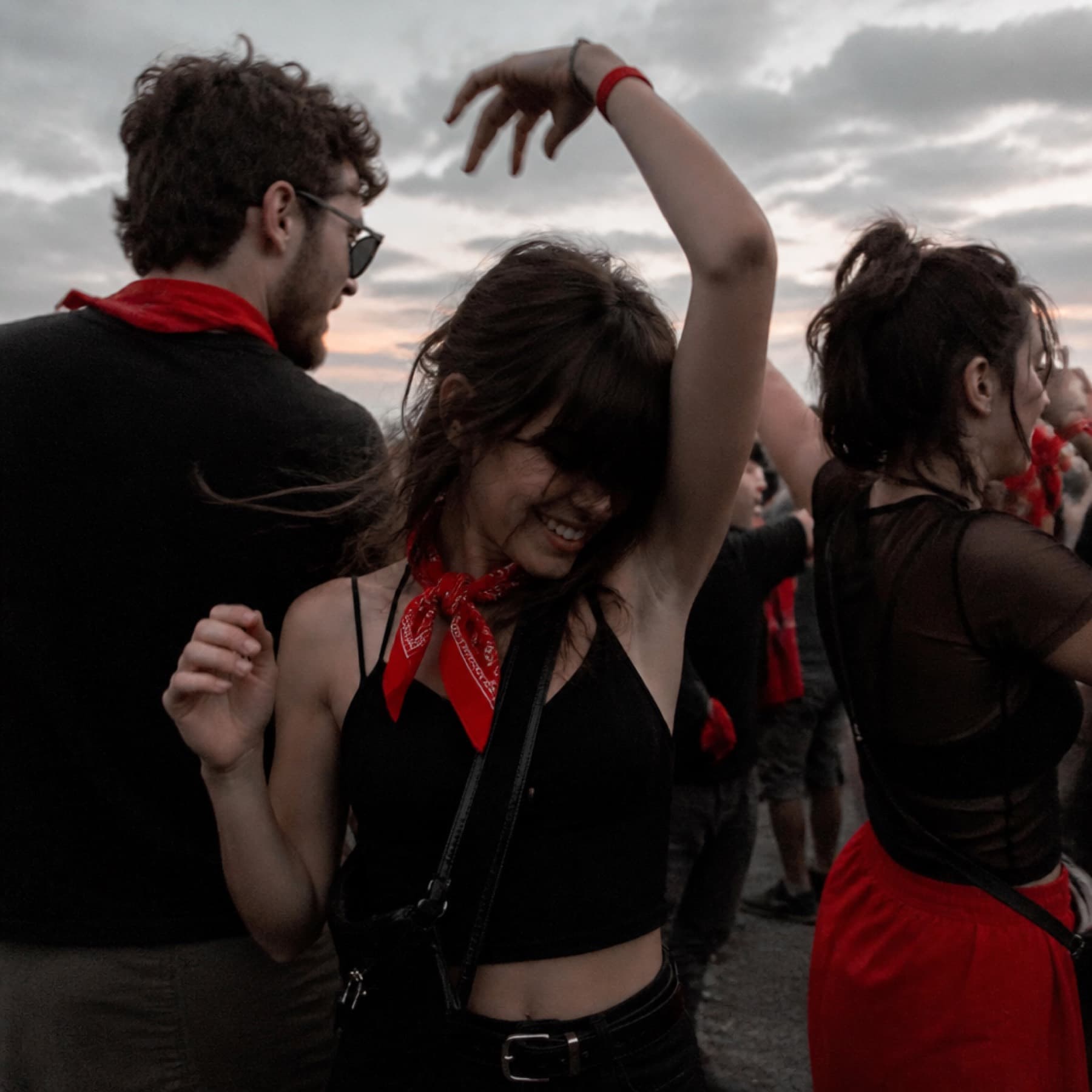 Guests dancing at dusk on the festival grounds