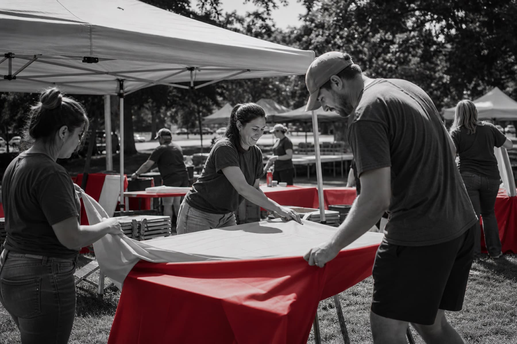 Volunteers setting up tents and tables before Choma Festival
