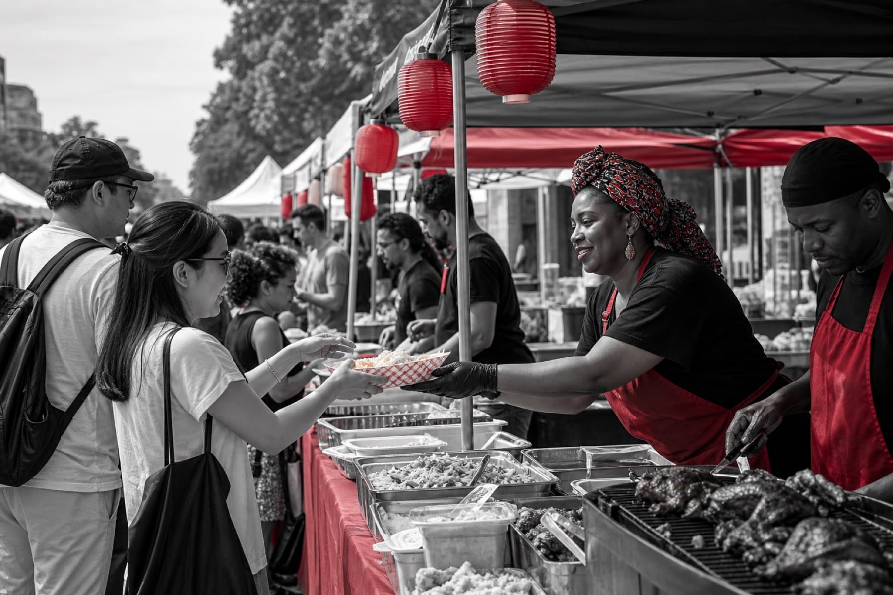 International street-food vendor stalls serving guests at an outdoor festival